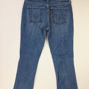 Levi's Mid Rise Boot Cut 553 Women Size 6 Medium 32 Inch Inseam Blue Logo Jeans